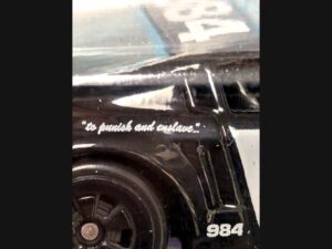 Close up of to punish and enslave decal on recalled Hot Wheels Transformers Barricade