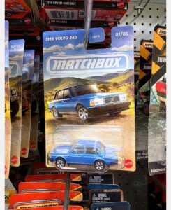 Matchbox 1986 Volvo 240 artwork card on retail peg with full series visible