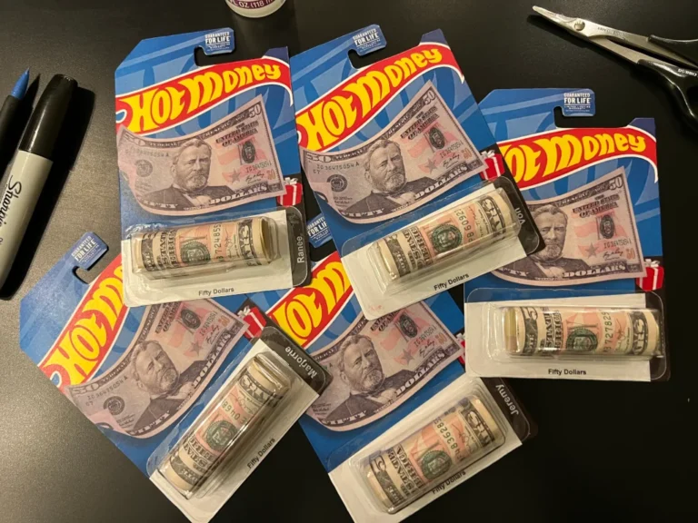 Custom carded Hot Wheels with rolls of cash in place of the diecast