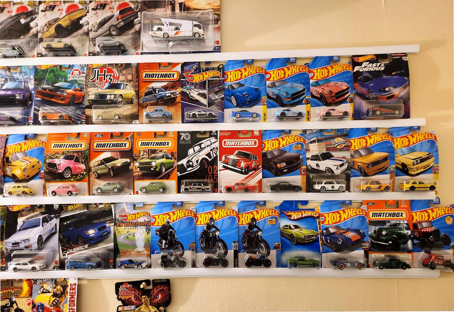 Hot Wheels and Matchbox cards displayed on PVC trim wall shelves